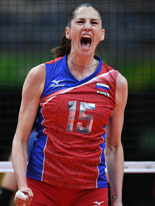 Tatyana Kosheleva melakukan selebrasi saat meraih point dalam bertanding melawan tim dari Korea Selatan di ajang Olimpiade 2016 di Maracanazinho, Rio de Janeiro, Brasil, (8/8). (AFP PHOTO/Johannes EISELE)