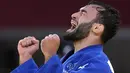 Luka Mkheidze dari Prancis bereaksi setelah bertanding melawan Kim Won-jin dari Korea Selatan dalam pertandingan judo medali perunggu -60kg putra Olimpiade Tokyo 2020, pada 24 Juli 2021, di Tokyo, Jepang. (AP Photo/Vincent Thian)