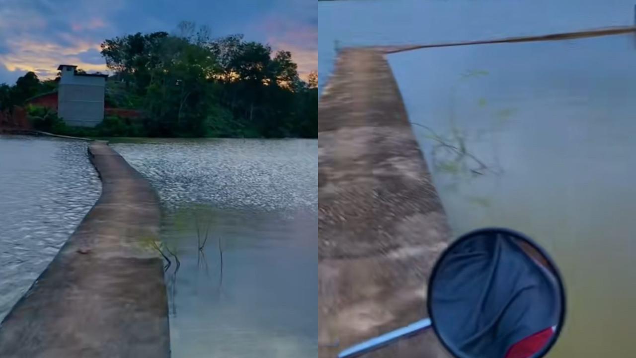 Wanita Seberangi Jembatan Sempit