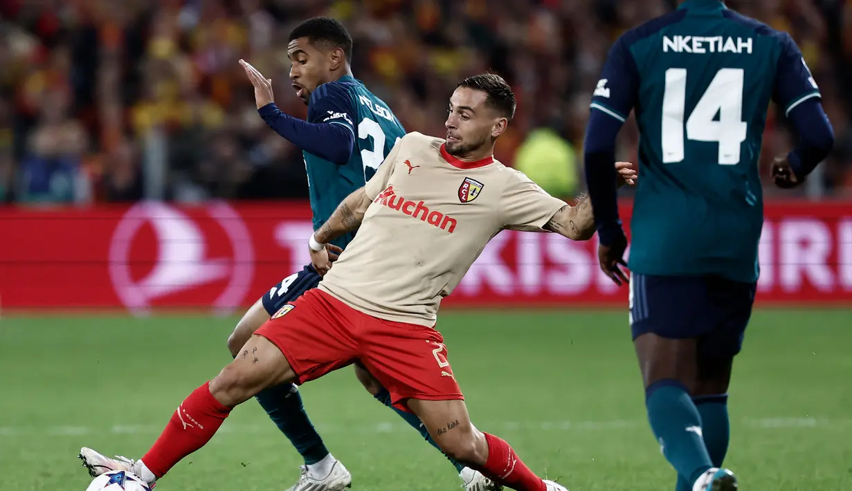 <p>Berkat hasil ini, Lens pun kini berhak memuncaki klasemen Grup B dengan poin 4. (Sameer Al-Doumy / AFP)</p>