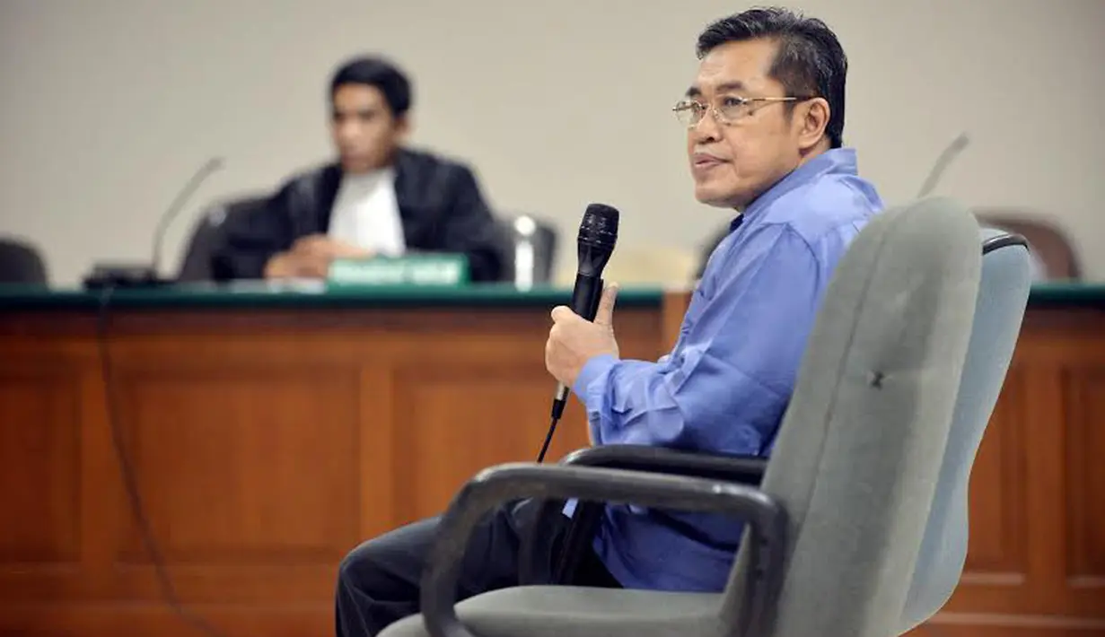 Mantan Direktur Urusan Agama Islam dan Pejabat Pembinaan Syariah Dirjen Bimas Islam Kemenag, Ahmad Jauhari dituntut 13 tahun (Liputan6.com/Johan Tallo) 