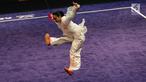 Atlet Timnas Wushu Indonesia Lindswell Kwok saat berlaga dalam pertandingan wushu nomor Tajijian putri di Kuala Lumpur Convention Centre Hall 5, Kuala Lumpur, Malaysia, Selasa (21/8). Lindswell meraih skor 9,68. (Liputan6.com/Faizal Fanani)