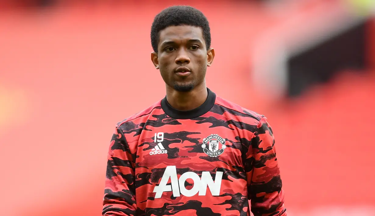 Amad Diallo. Sayap berusia 19 tahun ini didatangkan Manchester United dari Atalanta pada pertengahan musim 2020/2021 dan hanya tampil dalam 8 laga hingga akhir musim. Peminjamannya ke Feyenoord musim ini batal akibat terbelit cedera saat sesi latihan terakhir. (Foto: AFP/Pool/Michael Regan)