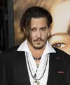 Siapa sangka di balik kerennya Johnny Depp ternyata ia gemar bermain dengan boneka Barbie? (AFP/Bintang.com)