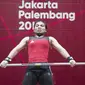 Atlet angkat besi, Sri Wahyuni, saat berlaga pada Asian Games di JIExpo, Jakarta, Senin, (20/8/2018). Sri Wahyuni menyumbang medali perak dengan total angkatan 195 kg. (Bola.com/Vitalis Yogi Trisna)