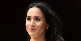 Meghan Markle nampaknya sudah muak dengan apa yang dilakukan Thomas Markle padanya. (EDDIE MULHOLLAND / POOL / AFP)