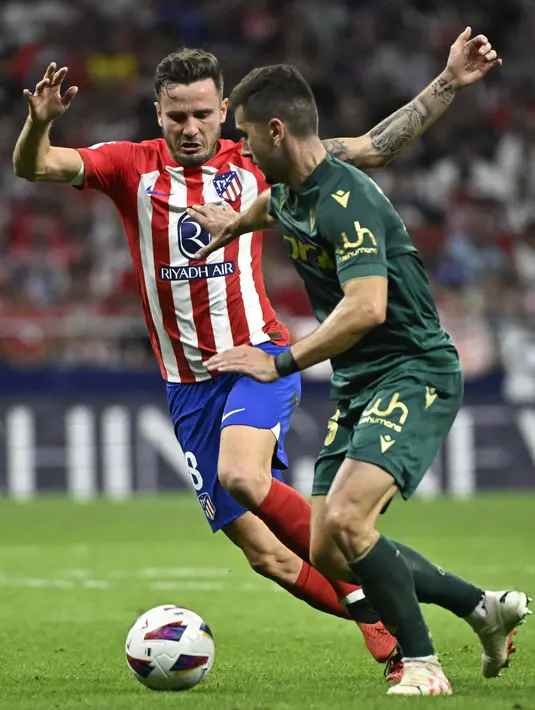 <p>Atletico Madrid menang tipis dengan skor 3-2 saat menjamu Cadiz. (JAVIER SORIANO / AFP)</p>