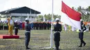 Suasana upacara bendera dalam perayaan HUT ke-74 RI di kilang JOB Pertamina-Medco EP Tomori Sulawesi, Sabtu (17/8/2019). Upacara yang diikuti seluruh karyawan tersebut digelar setiap tahun guna menumbuhkan rasa cinta Tanah Air. (Liputan6.com/Immanuel Antonius)