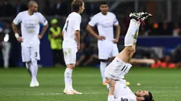Gareth Bale melakukan pemanasan saat babak  extra-time melawan Atletico Madrid pada Final Liga Champions di San Siro Stadium, Milan, (29/5/2016) WIB. (AFP/Filippo Monteforte)