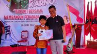 Billion Prayoga (10), siswa kelas VI SDN 164 Palembang Sumsel, yang tiga tahun berturut-turut meraih juara di Lomba Pidato Bung Karno, dalam peringatan Bulan Bung Karno PDIP Sumsel (Liputan6.com / Nefri Inge)