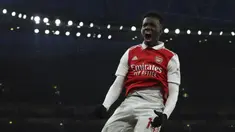 Pemain Arsenal, Eddie Nketiah melakukan selebrasi setelah mencetak gol pembuka timnya ke gawang Manchester United pada laga lanjutan Liga Inggris 2022/2023 yang berlangsung di Emirates Satdium, London, Minggu (23/01/2023). Arsenal berhasil menang dengan skor 3-2 atas Manchester United. (AP Photo/Ian Walton)