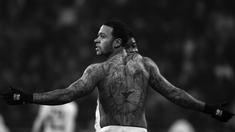 Pemain Olympique Lyonnais, Memphis Depay memiliki tato bergambar kepala Singa, Tato singa ini mempresentasikan saya. Saya memiliki jiwa layaknya seekor singa. Saya mendapatkan tato ini ketika saya berada di MU.. (AFP/Jeff Pachoud)