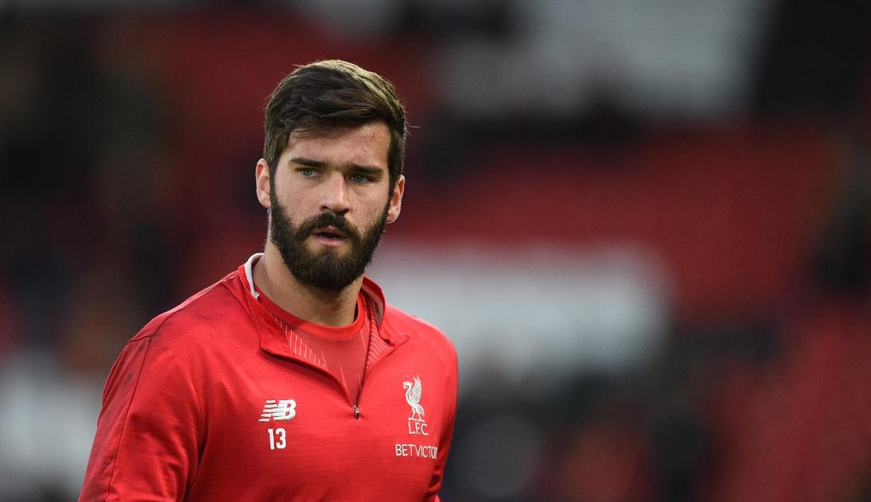 1. Alisson Becker (Liverpool) - 38 pertandingan, 21 clean sheet (AFP/Oli Scarff)