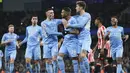 Manchester City sukses memetik kemenangan pada laga pekan ke-24 Liga Inggris 2021/2022 saat menjamu Brentford di Etihad Stadium, Kamis (10/2/2022) dini hari WIB. (AFP/Jon Super)