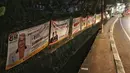 Spanduk-spanduk calon legislatif (caleg) terpampang di sepanjang Jalan Bintaro Permai, Jakarta, Kamis (3/1/2019). Spanduk tersebut berisi janji-janji untuk memikat hati calon pemilih. (Liputan6.com/JohanTallo)