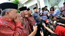 Ketua Umum MUI, Prof Dr Din Syamsuddin saat memberi  keterangan kepada wartawan seusai menemui Presiden Joko Widodo di Istana Merdeka,  Jakarta,  Selasa (3/2/2015). (Liputan6.com/Faizal Fanani)