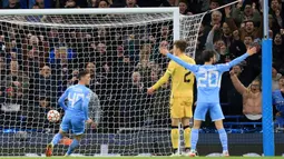 Phil Foden. Di matchday keempat Grup A, Man City gantian menjamu Club Brugge, 3 November 2021. Dalam laga yang berakhir 4-1 untuk kemenangan Man City, Phil Foden sebagai pencetak gol pertama terpilih menjadi Man of The Match atas agresifitas dan akurasi umpannya. (AFP/Lindsey Parnaby)