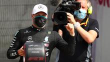 Pembalap Mercedes, Valtteri Bottas meraih pole position pada sesi kualifikasi Formula 1 (F1) 2020 di Sirkuit Silverstone, Inggris, Sabtu (8/8/2020). (Bryn Lennon / POOL / AFP)