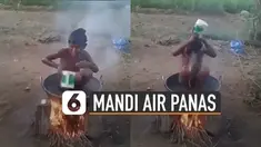 Bukannya kepanasan tapi bocah ini sangat menikmati mandi air panasnya.