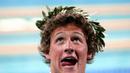 Pada Olimpiade pertamanya di Athena 2004, Ryan Lochte langsung berhasil mempersembahkan medali emas. Lochte yang saat itu masih 20 tahun memenangi nomor beregu 4x200 m gaya bebas. (AFP/Francois Xavier) 
