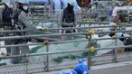 Para pekerja menyingkirkan bahan bangunan sebelum istirahat makan siang di pembangkit listrik tenaga nuklir Fukushima Daiichi, di kota Futaba, timur laut Jepang, Jumat, 14 Juli 2023. (AP Photo/Hiro Komae)