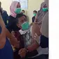 Tangkapan layar video viral Kepala Puskesmas di Gorontalo yang takut disuntik (Arfandi Ibrahim/Liputan6.com)