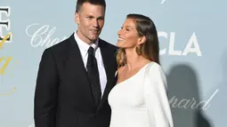 Tom Brady, quarterback juara Super Bowl tujuh kali yang saat ini bermain untuk Tampa Bay Buccaneers, dan istrinya, Gisele &uuml;ndchen, seorang model fesyen, telah menyewa pengacara perceraian. (Kein Winter/Getty Images/AFP, File)