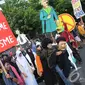 Aksi 'Jaga Jakarta' yang didominasi oleh kaum muda ini mengajak   warga Jakarta untuk bersama-sama menolak radikalisme dan terorisme,   Jakarta, Minggu (23/11/2014). (Liputan6.com/Herman Zakharia)