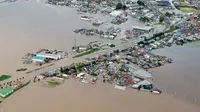 Di Balik Foto Dramatis Penyelamatan Korban Banjir Jepang