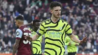 Declan Rice tak melakukan selebrasi setelah mencetak gol untuk Arsenal ke gawang mantan timnya, West Ham dalam laga lanjutan Premier League 2023/2024, Minggu (11/2/2024) malam WIB. (AP Photo/Ian Walton)