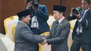 Presiden Prabowo Subianto berbincang dengan Presiden ketujuh RI Joko Widodo usai menyampaikan Pidato Kenegaraan di gedung parlemen di Jakarta, Indonesia, Jumat, 14 Agustus 2026.(AP Photo/Dita Alangkara)