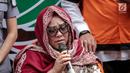 Komedian Tri Retno Prayudati alias Nunung menyampaikan penyesalan saat rilis kasus narkoba di Polda Metro Jaya, Jakarta, Senin (22/7/2019). Nunung ditangkap bersama suaminya, July Jan Sambiran, usai bertransaksi narkoba dengan tersangka TB di kediaman mereka. (Liputan6.com/Faizal Fanani)