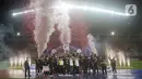 Pemain Persis Solo merayakan kemenangan usai merebut gelar juara Liga 2 Indonesia 2021 di Stadion Pakansari, Bogor, Kamis (30/12/2021). Di Final, Persis Solo berhasil mengalahkan Rans Cilegon United 2-1. (Liputan6.com/Helmi Fithriansyah)