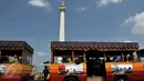 Monumen Nasional atau Monas masih menjadi tempat favorit wisata warga untuk berlibur, Jakarta, Minggu (19/7/2015). Ikon kota Jakarta tersebut menjadi tempat wisata alternatif warga saat liburan lebaran. (Liputan6.com/Johan Tallo)