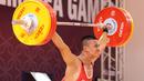 Atlet Indonesia, Rizki Juniansyah, berlaga pada cabang angkat besi 73 Kg putra SEA Games 2023 di Phnom Penh, Kamboja, Minggu (14/5/2022). Rizki Juniansyah berhasil merebut medali emas di pertandingan ini. (Bola.com/Abdul Aziz)