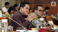 Menteri BUMN, Erick Thohir (kiri) bersama Wakil Menteri BUMN Kartika Wirjoatmodjo mengikuti rapat dengan Komisi VI DPR di kompleks Parlemen, Jakarta, Senin (2/12/2019). Rapat membahas Penyertaan Modal Negara (PMN) pada Badan Usaha Milik Negera tahun anggaran 2019 dan 2020. (Liputan6.com/Johan Tallo)