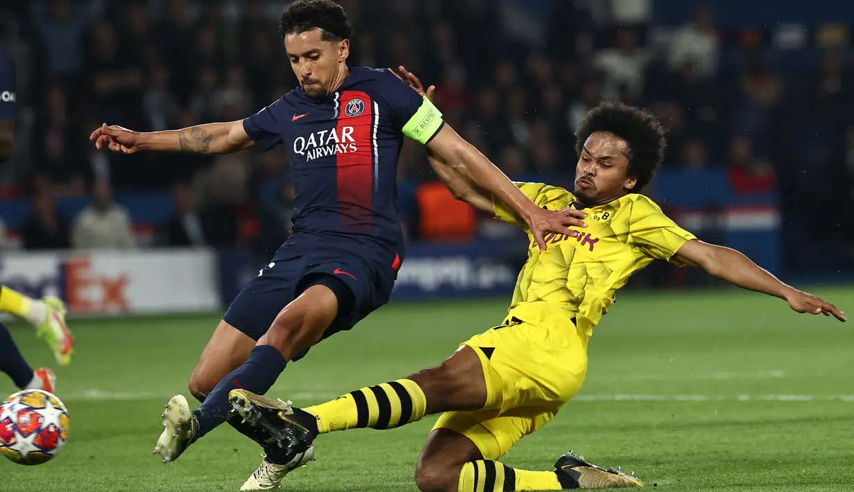 Dortmund berhasil membungkam tuan rumah PSG dengan skor 1-0. (Anne-Christine POUJOULAT / AFP)