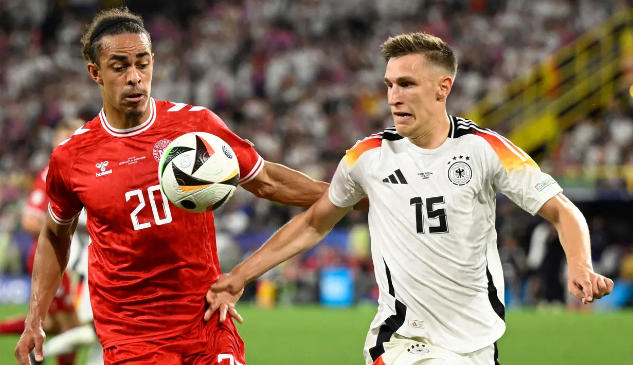 Berstatus tuan rumah, Jerman tampil agresif sejak awal laga. (INA FASSBENDER/AFP)