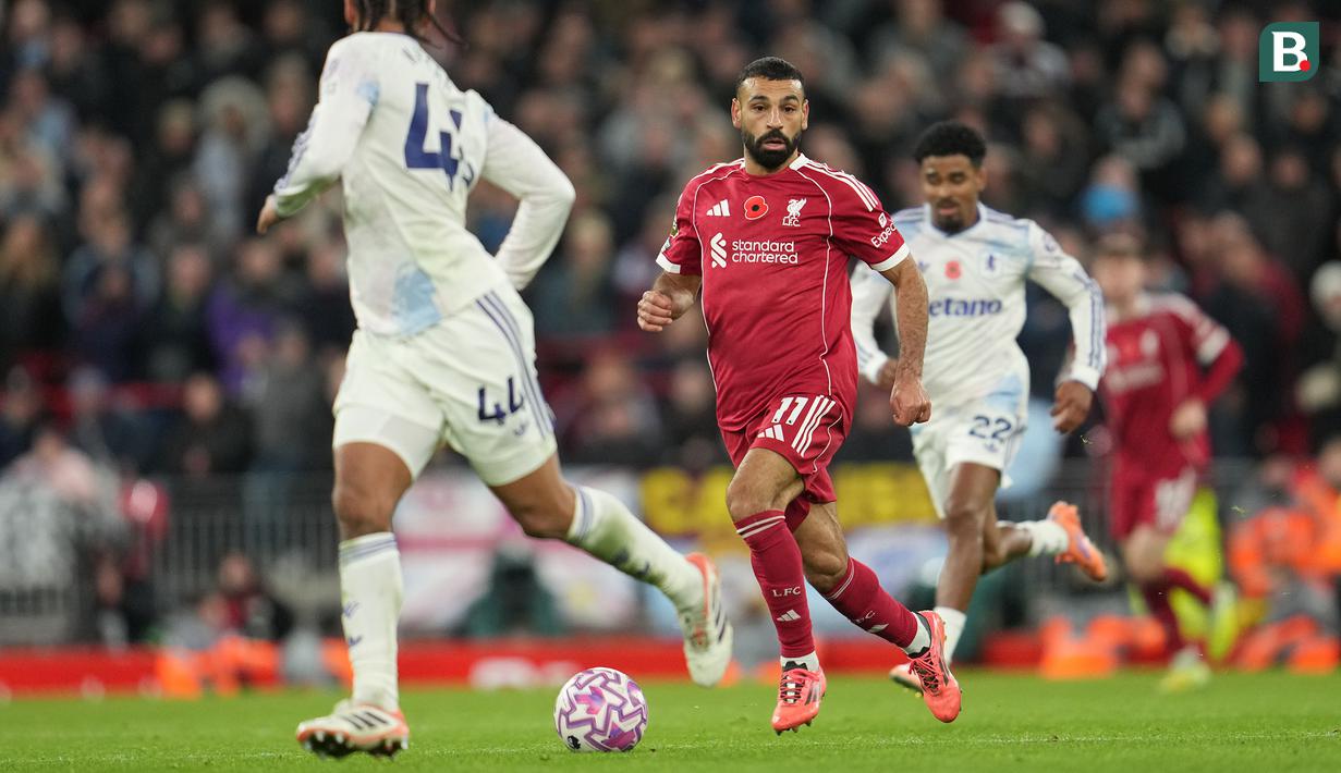 Pria berkebangsaan Mesir tersebut juga berhasil menyamai rekor kontribusi gol di satu klub Liga Inggris milik Wayne Rooney, dengan total 276 gol (188 gol dan 88 assist) dari 298 laga liga bersama Liverpool. (AP Photo/Jon Super)