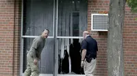 Otoritas setempat menyelidiki lokasi kejadian ledakan bom di Dar al-Farooq Islamic Center, Bloomington, Minneapolis (AP)