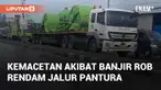 Banjir rob kembali rendam jalur Pantura Semarang-Demak di Kecamatan Sayung. Antrean panjang kendaraan terjadi sejak pagi akibat banjir hingga 60 cm