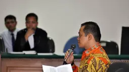 Muhtar Ependy didakwa menghalangi penyidikan perkara tindak pidana korupsi pencucian uang dengan tersangka Akil Mochtar yang ditangani oleh KPK, Jakarta, Kamis (20/11/2014). (Liputan6.com/Miftahul Hayat)