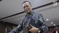 Mantan anggota Komisi XI DPR RI dari Fraksi Partai Demokrat, Amin Santono usai menjalani sidang perdana di Pengadilan Tipikor, Jakarta, Kamis (20/9). Sidang beragendakan pembacaan dakwaan dari JPU KPK. (Liputan6.com/Helmi Fithriansyah)