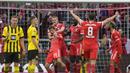 <p>Pemain Bayern Munchen merayakan gol yang dicetak oleh Thomas Muller (tengah) pada laga pekan ke-26 Liga Jerman 2022/2023 melawan Borussia Dortmund di Allianz Arena, Munchen, Jerman, Minggu (02/04/2023) WIB. Die Roten menang dengan skor 4-2.&nbsp;(AP Photo/Matthias Schrader)</p>