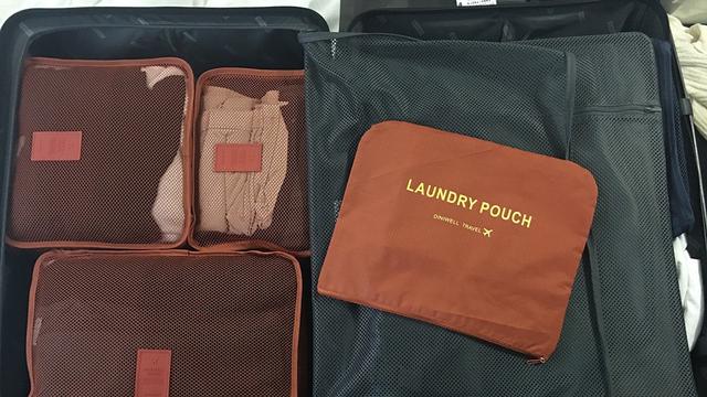 Ilustrasi koper, packing pakaian