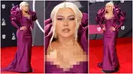 Foto kolase Christina Aguilera saat menghadiri Latin Grammy Awards 2022 di Michelob Ultra Arena, Las Vegas, Nevada, Amerika Serikat, 17 November 2022. Melengkapi penampilannya, Christina menggunakan anting-anting yang menjulur sepanjang separuh lehernya. (Frazer Harrison/Getty Images/AFP)