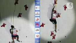 Atlet Panjat Tebing Putra Indonesia, Aspar (kanan) saat beradu cepat melawan rekan setimnya, Kiromal Katibin di Babak Final Kejuaraan Panjat Tebing Dunia IFSC 2022 di Jakarta, Sabtu (24/9/2022). Aspar menempati posisi utama dengan catatan waktu 5,39 detik. (Liputan6.com/Helmi Fithriansyah)