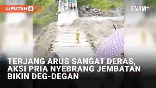 VIDEO: Terjang Arus Sangat Deras, Aksi Pria Nyebrang Jembatan Bikin Deg-Degan