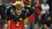 1. Marouane Fellaini (Belgia), gelandang kribo asal klub Manchester United ini tampil dengan rambut yang diwarnai pirang pada ajang Piala Eropa 2016. (AFP/Emmanuel Dunand) 