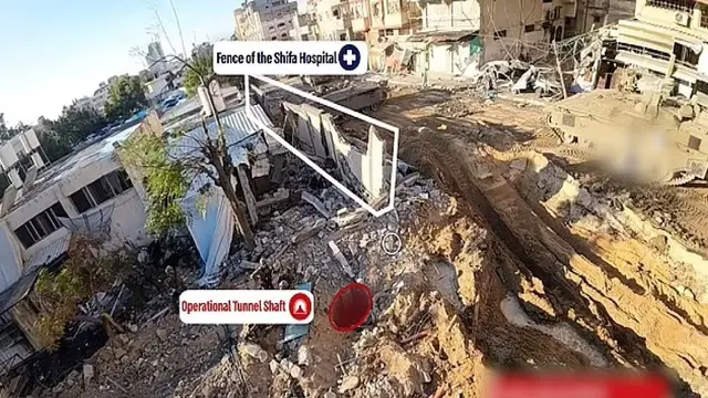Rekaman drone diduga menunjukkan sebuah lubang menuju terowongan yang menurut militer Israel di RS Al-Shifa di Gaza yang diigunakan oleh teroris Hamas.(Israel Defense Forces)